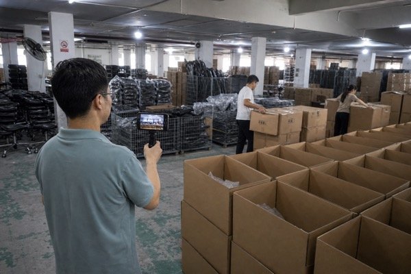 Office chair factory video tour showing assembly and packing area