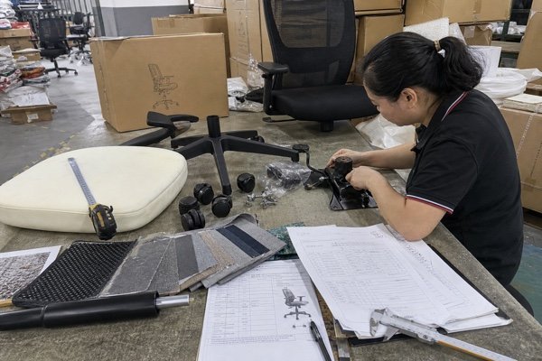 Office chair sample inspection with foam gas lift base and carton packaging