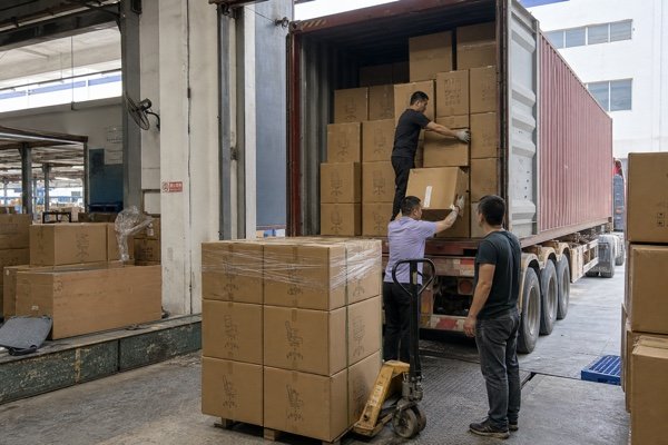 Office chairs packed in cartons and loaded into an export container